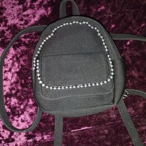A black mini purse/Backpack with pearls